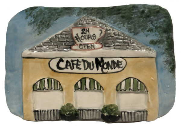 ceramic plauque of Face De Monde in New Orleans.