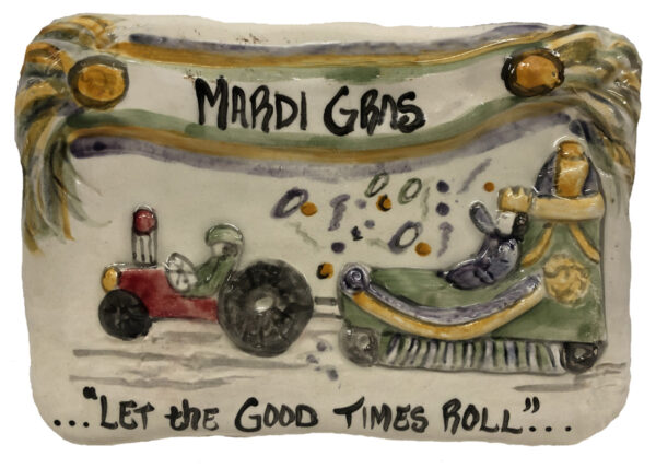 Plaque depicting a tractor pulling a parde float at Mardi Gras.