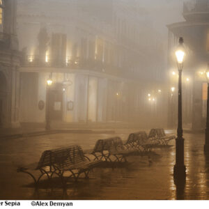 foggy mysterious New Orleans street with lamps and benches.