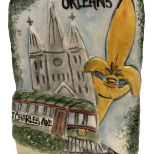 Ceramic plaque celebrating New Orleans with a Fleur de Lis, Streetcar and St. Louis Cathedral.