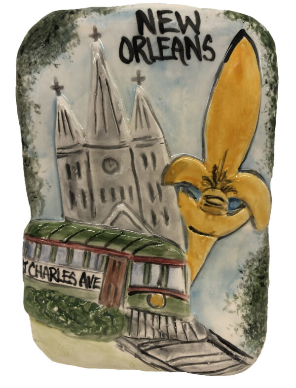 Ceramic Plauque celebrating New Orleans with a Fluer De Lis, Trolly, and Cathedral.