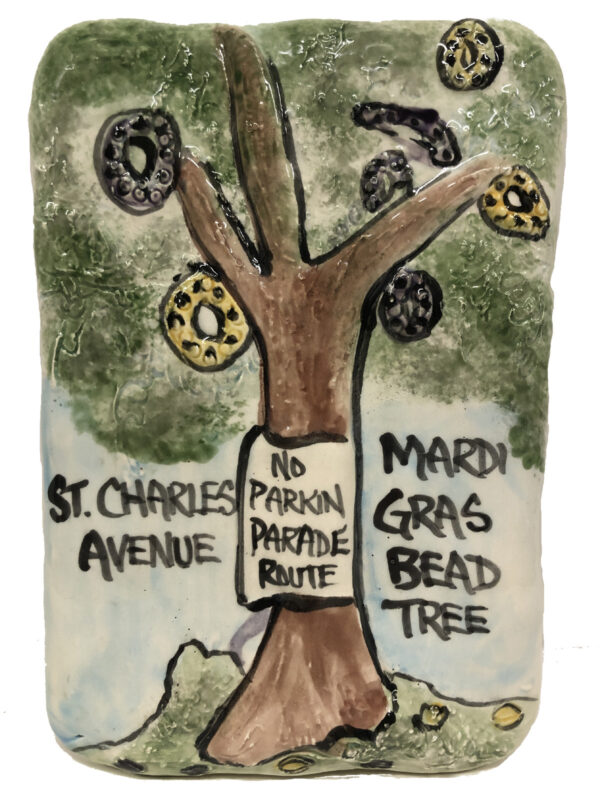 Ceramic plaque depicting Mardi Gras beads stuck in the tree on St. Charles Ave.