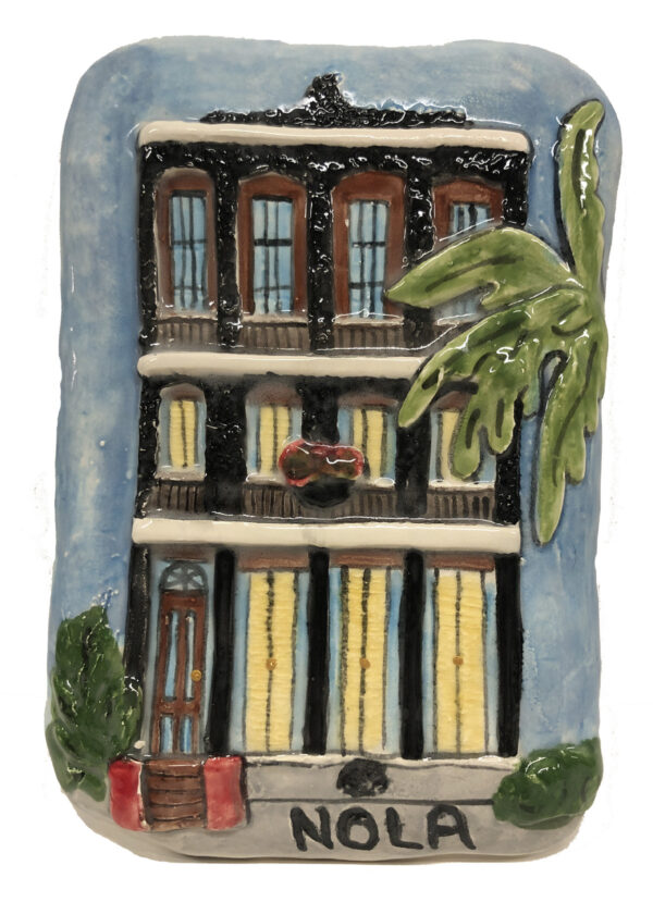 Uptown Greek Revival house depicted with it's distinctive wrought iron design.