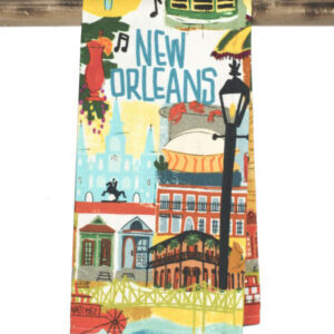 colorful kitchen towel featuring New Orleans buildings, music notes, and a light post.