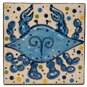 Blue Crab painted on a ceramic tile.