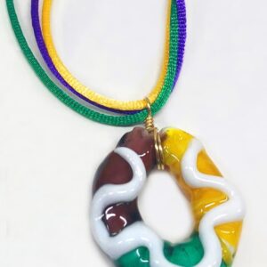 Purple, Green and Yellow Glass pendant in shape of a Mardi Gras King Cake with white paint for icing on top.